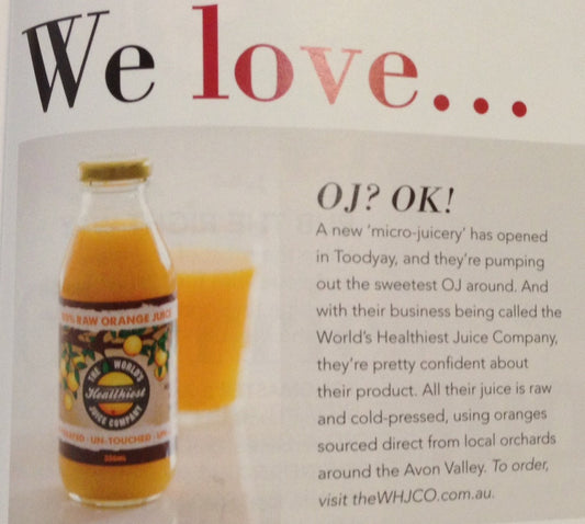 A magazine "We love" clipping featuring a bottle of World's Healthiest Juice Company 100% raw orange juice, about the Toodyay micro-juicery