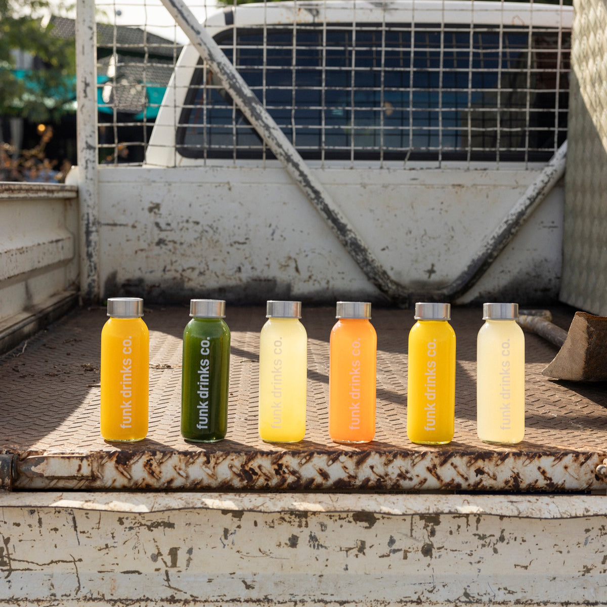 The full Funk cold pressed juice range lined up on a farm ute tray